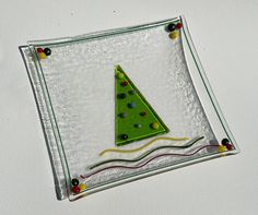 a glass plate with a christmas tree on it