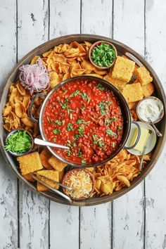 a platter filled with chips and salsa