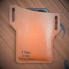 an orange leather wallet with the words i can, i will end of story written on it