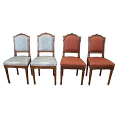 four chairs with upholstered back and seat cushions