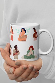 a woman holding a coffee mug with different women on it