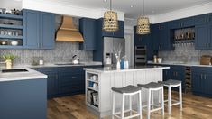 a large kitchen with blue cabinets and white counter tops, two stools at the island