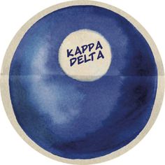 a blue and white bowl with the words kappa delta on it