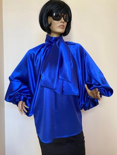 "This is a very stylish Womens Satin blouse. It is comfortable and cozy. Made for a free flowing fit. Great for all year around and for any special occasion or casual day can be dressed up or dressed down. SIZE CHART SIZE S - US 6, UK 8, EU 36 bust: bust around 34.5\"/90cm Waist: waist around 27.5\"/70cm Hips: hips around 34.5\"/90cm SIZE M - US 8, UK 10, EU 38 bust: bust around 37.5\"/95cm Waist: waist around 29.5\"/75cm Hips: hips around 37.5\"/95cm SIZE L - US 10, UK 12, EU 40 bust: bust arou Spring Satin Blouse For Office, Elegant Blue Blouse For Fall, Chic Satin Finish Evening Blouse, Chic Satin Evening Blouse, Chic Blouse With Bow For Night Out, Chic Satin Finish Blouse For Evening, Long Sleeve Evening Tops With Bow, Evening Tops With Bow And Long Sleeves, Spring Evening Blouse With Bow