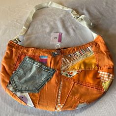 an orange purse with patchwork on it