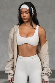 Front view of model posing in the stretchy and sculpting sueded yuma contour bra with a deep scoop neckline and curved hem Low-cut Sports Bra For Loungewear, Joah Brown Cage Bra, Compressive Seamless Cropped Sports Bra, Solid Cropped Activewear With Built-in Bra, Coverage Bras, Joah Brown, Female Portraits, Body Contouring, Bra Top