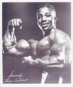 a black and white photo of a man flexing his muscles