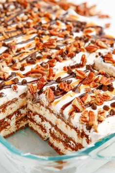 Turtle Ice Cream Sandwich Cake in a pan with a piece missing. Ice Cream Sandwich Cake Recipe, Ice Cream Sandwich Dessert, Turtle Ice Cream, Ice Cream Dessert Recipe, Cream Sandwich Cake, Pudding Pops, Dessert Pies, Vanilla Ice Cream Sandwich, No Bake Summer Desserts