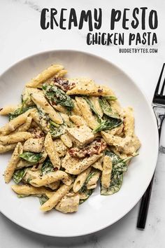 creamy pesto chicken pasta on a white plate