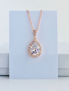 Luxury clear cubic zirconia bridal teardrop dangle pendant and necklace in gold plated brass setting. Necklace pendant features a large teardrop with pear cut clear cubic zirconia center surrounded by tiny round zirconia crystals and dangles from cubic zirconia bail. Length of the gold plated chain is 18 inches and comes with 2 inches extender and lobster clasp. For matching earrings click: https://www.etsy.com/listing/503589977/rose-gold-crystal-earrings-rose-gold?ref=shop_home_active_5 For a s Crystal Wedding Jewelry, Gold Bridal Earrings, Zirconia Necklace, Rose Gold Crystal, Necklace Rose Gold, Rose Gold Bridal, Cubic Zirconia Necklace, Necklace Rose, Teardrop Necklace