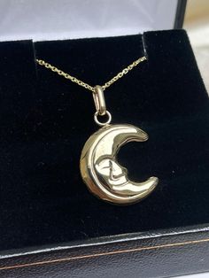 Enhance your jewelry collection with this exquisite Italian Moon necklace, crafted by Simonian® Jewelry. The yellow gold necklace is 28 inches long and features a hollow charm pendant in the shape of a moon with a content smile. The pendant is made of Solid 14K Gold and comes with a Certificate Guarantee. The necklace is perfect for anyone who loves fine jewelry and wants to add a touch of elegance to their look. The charm does not have any stones, making it a versatile piece that can be worn wi Fine Gold Jewelry With Moon Phase, Gold Crescent Jewelry For Formal Occasions, Celestial Half Moon Yellow Gold Jewelry, Spiritual Crescent Necklace For Anniversary, Gold Moon Phase Necklace In Fine Jewelry, Gold Celestial Necklace With Polished Finish, 14k Gold Crescent Celestial Necklace, Celestial Engraved 14k Gold Necklace, 14k Gold Moon Charm Necklace