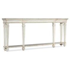 a white console table with two columns