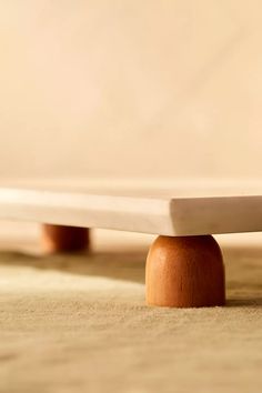 a close up of a wooden object on the ground