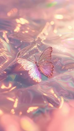 a pink butterfly floating on top of water with bubbles in the background and light reflecting off it's wings