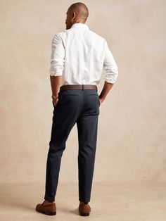 A sophisticated spin on our best-selling chinos, this tapered cotton pant has a pleated front and soft center crease at back so it's simple to fold and looks tailored when worn.  ATHLETIC TAPERED FIT: Not just for athletes, this fit is designed to de Casual Cotton Chinos For Semi-formal Occasions, Elegant Chino Cotton Twill Chinos For Business Casual, Elegant Chinos In Chino Cotton Twill For Business Casual, Elegant Chinos For Business Casual, Slim Fit Tapered Leg Chinos For Business Casual, Classic Chino Cotton Twill Dress Pants For Work, Business Casual Tapered Leg Chinos With Welt Pockets, Classic Ankle-length Chinos With Belt Loops, Formal Relaxed Fit Chinos With Tapered Leg