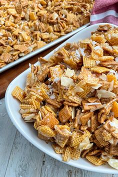 a white plate topped with cheetos next to a baking dish