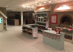 the inside of a store with lots of counter space and food on display in it