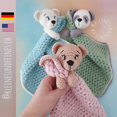 there is a crocheted teddy bear in the middle of three other stuffed animals