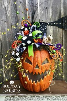 a decorated pumpkin sitting on top of a table