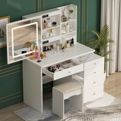 a white vanity table with drawers and mirror