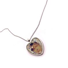 Add a unique and charming touch to your accessory collection with this original necklace by Damon Albarn and Alex James! Perfect for fans of the British band, Blur. This necklace features a heart-shaped pendant with an image of Damon and Alex, with a holographic effect glitter background. 𝗣𝗥𝗢𝗗𝗨𝗖𝗧 𝗗𝗘𝗧𝗔𝗜𝗟𝗦  ✨Unique Design: The pendant showcases a crisp image encapsulated in a heart with a glittery background that shines in the light. A unique, handmade piece.  📏Perfect Size: The pen Handmade Heart Necklace For Personalized Gift, Handmade Heart Pendant Jewelry For Memorial, Custom Heart Necklace For Mother's Day, Custom Silver Heart Necklace, Heart Charm Pendant Necklace For Memorial, Customized Silver Heart Necklace, Customized Silver Necklace For Memorial, Memorial Heart Charm Pendant Necklace, Handmade Heart-shaped Keepsake Necklace