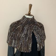 Please note that the buttons might be different from the ones on the pictures, but I'll give you options to choose from. This beautiful, one-of-a-kind, hand-knitted poncho is made with acrylic yarn in shades of brown and black and finished with wooden buttons . It feels soft and comfortable and will keep you warm in the cold, winter days. Please note that every poncho will look a bit different due to the changing colors of the yarn. Please note that the buttons might be different from the ones o Handmade One-size Fall Cape, Handmade One-size Cape For Fall, Handmade One Size Cape For Fall, Hand Knitted Brown Poncho For Fall, Hand-knitted Brown Poncho For Fall, Outlander Brianna, Food Pillows, Flannel Scarves, Cute Octopus