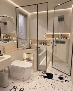 a bathroom with a white toilet sitting next to a walk in shower