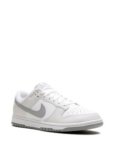 Nike's Dunk Low silhouette was designed to incorporate basketball influence into a low-top sneaker. Crafted from white and Light Smoke Grey leather, this model introduces a new and fresh colourway to the footwear icon Low Dunks, White Shoes Men, Embroidered Lace Top, Grey Sneakers, Retro Sneakers, Nike Dunk Low, Dunk Low, Nike Dunk, Grey Leather