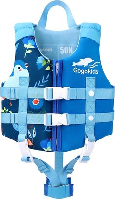 a child's life vest with an image of dolphins and fish on the back