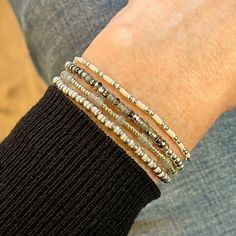 Band: Flat woven; 3/4"w; glass seed beads; 14K gold-filled clasp & 1" extender chain. Strands: Stretch style; mix of 14K gold-filled & sterling silver 2mm & 3mm round beads; 2.5mm freshwater pearls; colorful & metal-tone glass seed beads; plated brass, gunmetal, and copper 3mm & 4mm beads. Great solo or stacked. Metal Bead Bracelet, Gold Stretch Bracelet, Silver Strand, Mod Squad, Chevron Bracelet, Sterling Silver Bead Bracelet, Beaded Cuff Bracelet, Silver Bead Bracelet, Ball Bracelet