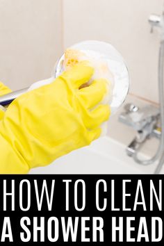 a person in yellow gloves cleaning a shower head