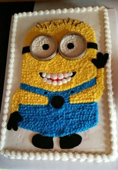 a cake that looks like a minion with big eyes