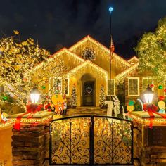 a house covered in christmas lights and decorations