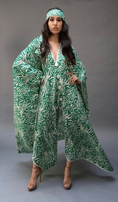 This lightweight kaftan dress  is perfect for lounging by a poolside or just to  throw on to wear all day. Green Bohemian Maxi Length Sets, Flowy Maxi-length Abaya For Eid, Elegant Long Sleeve Green Tunic, Traditional Green Dress With Kimono Sleeves, Flowy V-neck Dresses For Eid, Long Kimono For Beach Eid Festival, Elegant Maxi Length Abaya For Vacation, Elegant Green Kaftan For Vacation, Elegant Abaya For Vacation