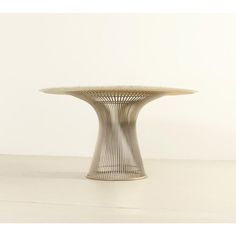 a white table sitting on top of a floor