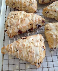 six scones on a cooling rack with icing