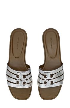 A dimensional Double-T logo stands out atop the strappy vamp of this breezy leather slide sandal. Leather upper and lining/rubber sole Imported Tan Sandals With Leather Footbed And Flat Heel, Tan Flat Sandals With Leather Footbed, Tan Flat Heel Sandals With Leather Footbed, Designer Slides With Leather Footbed And Flat Heel, Classic Silver Sandals For Summer, Leather Slides In Tan For Summer, Designer Summer Mules With Leather Lining, Tan Open Toe Sandals With Cushioned Footbed, Tan Sandals With Cushioned Footbed And Flat Heel