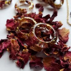 Sizes Available: 6, 7, 8, 9, 10, 11, 12, & 13 Message Me With What Size You Need Beautiful Smoothed Resin Band Ring With Real Garnet Red Dried Rose Petals, And Delicate Gold Flakes. **Please Note That Every Ring Is Handmade, And Will Vary Slightly In Flower/Gold Ratio.*** Finely Detailed Flower Petals From Dried Burgundy Roses. Whole Flowers, Hand Picked, And Gently Dried To Preserve Their Natural Beauty. Royal Reds Paired With Flakes Of Brilliant Gold Make This A Revered Statement Piece. A Bouq Rose Petal Resin, Gold Ratio, Burgundy Roses, Real Rose Petals, Garnet Red, Dried Rose Petals, Burlap Ribbon, Resin Ring, Gold Flakes