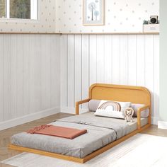 a child's bed in a room with white walls