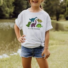 The perfect shirt for the dinosaur loving kid! T-Rex, stegosaurus, triceratops and more!  D is for Dinosaur kids/toddler/baby tshirt, dinosaur loving toddler, gifts for kids, toddler tshirt, dinosaur birthday party shirt ----WASHING INSTRUCTIONS----- - Please turn the tee inside out before washing - Cold machine wash in gentle cycle - Do not bleach - Do not dry clean - Do not iron over the HTV Playful Dinosaur Print Crew Neck T-shirt, Fun Short Sleeve Dinosaur Print T-shirt, D Is For Dinosaur, Dinosaur Birthday Party, Birthday Party Shirt, Dinosaur Kids, Dinosaur Birthday, Toddler Gifts, Party Shirts