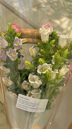 a bouquet of flowers in a clear plastic bag