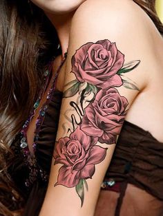 a woman with a rose tattoo on her arm