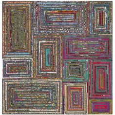 a multicolored area rug with squares and rectangles in different colors on it