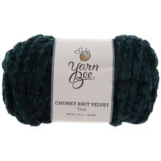 yarn ball in dark green, with the label for yarn bee chunk knitt velvet