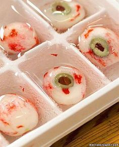 the inside of an ice box filled with donuts covered in blood