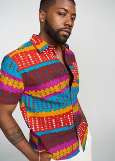 Style#: M2015​ Step out with confidence, in our Keyon Men's African Print Button-Up Shirt in Orange Teal Adire. This dynamic cotton, button-up, shirt is a statement piece for the contemporary man who embraces bold style. Description Orang Button-Up Shirt Short Sleeve Collared Neckline Pocket at Chest 100% Cotton Designed in the USA, imported *Print placement may vary* Care Instruction Hand Wash Cold. Mild Detergent. Do Not Bleach. Hang to Dry. Models Size: M | Height: 6'2 | Chest: 40 | Waist: 33 Modern African Clothing, Dashiki For Men, African Print Clothing, African Clothing For Men, African Men Fashion, Bold Style, African Men, Print Placement, Shirt Short Sleeve