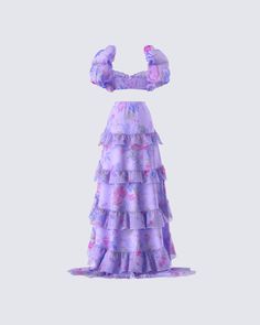 The princess is here 👑 With a look that will have everyone bowing down to you, this two-piece set features a purple floral cropped top paired with a matching organza maxi skirt 💜 Spring Two-piece Cropped Dress, Purple Two-piece Party Set, Purple Two-piece Set For Party, Purple Ruffled Sets For Spring, Spring Purple Ruffled Sets, Summer Prom Tiered Maxi Skirt, Summer Tiered Maxi Skirt For Prom, Tiered Maxi Skirt For Summer Prom, Spring Party Sets With Tiered Skirt