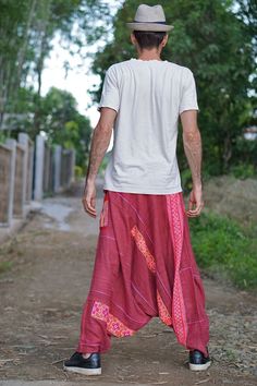 "Harem Pants, Hemp Men Pants, Hemp Clothing, Hemp Pants Sizing: Made in one size to fit M to XL / US: 8/10/12/14 / Custom size please inquire. Measurement; Waist max 37\" (smaller waist, just adjust the tie to fit you) Hip max 45\" Length outseam 42\" Leg opening 15\" around **Model is a size EU 38 or M. 184 cm tall** Description: One of a kind treasure! 100% high-quality soft vintage hand-loomed hemp fabric. This is very special harem pants fully made with the original vintage Hmong hand-loomed Hippie Stretch Wide-leg Harem Pants, Red Cotton Ankle-length Harem Pants, Non-stretch Bohemian Harem Pants, Vintage Harem Pants, Fitted Bohemian Full-length Harem Pants, Men Pants, Men’s Harem Pants, Hmong Embroidery, Hemp Clothing