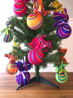 a christmas tree decorated with brightly colored ornaments