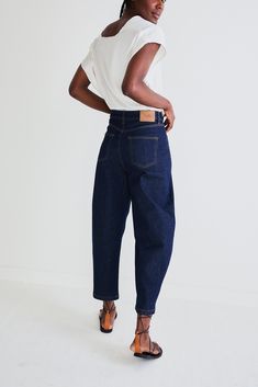 Our classic barrel leg denim pants in a new dark wash. A tapered leg and a wider leg makes for a flattering fit. Barrel leg Belt loops 2 side pockets 2 Back Pockets Slight stretch Long Denim Jacket, Leg Belt, Oversized Blouse, Great Lengths, Loose Blouse, Olive Color, Fashion Help, Silk Top, Leg Jeans